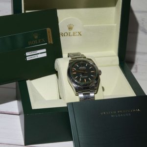 Elegant stainless steel watch showcased in original packaging with documents.