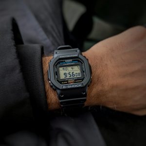 Detailed view of a Casio G-Shock watch on an adult's wrist in Canada.