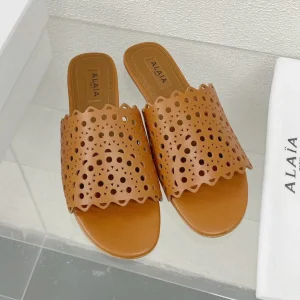 ALAIA VIENNE FLAT MULES IN CHOCOLATE BROWN LAMBSKIN