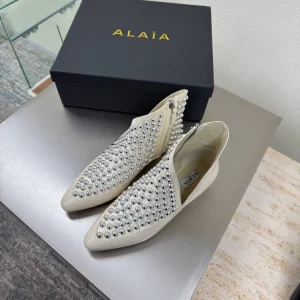 ALAIA Rivet ankle boots ivory cowhide leather 471092