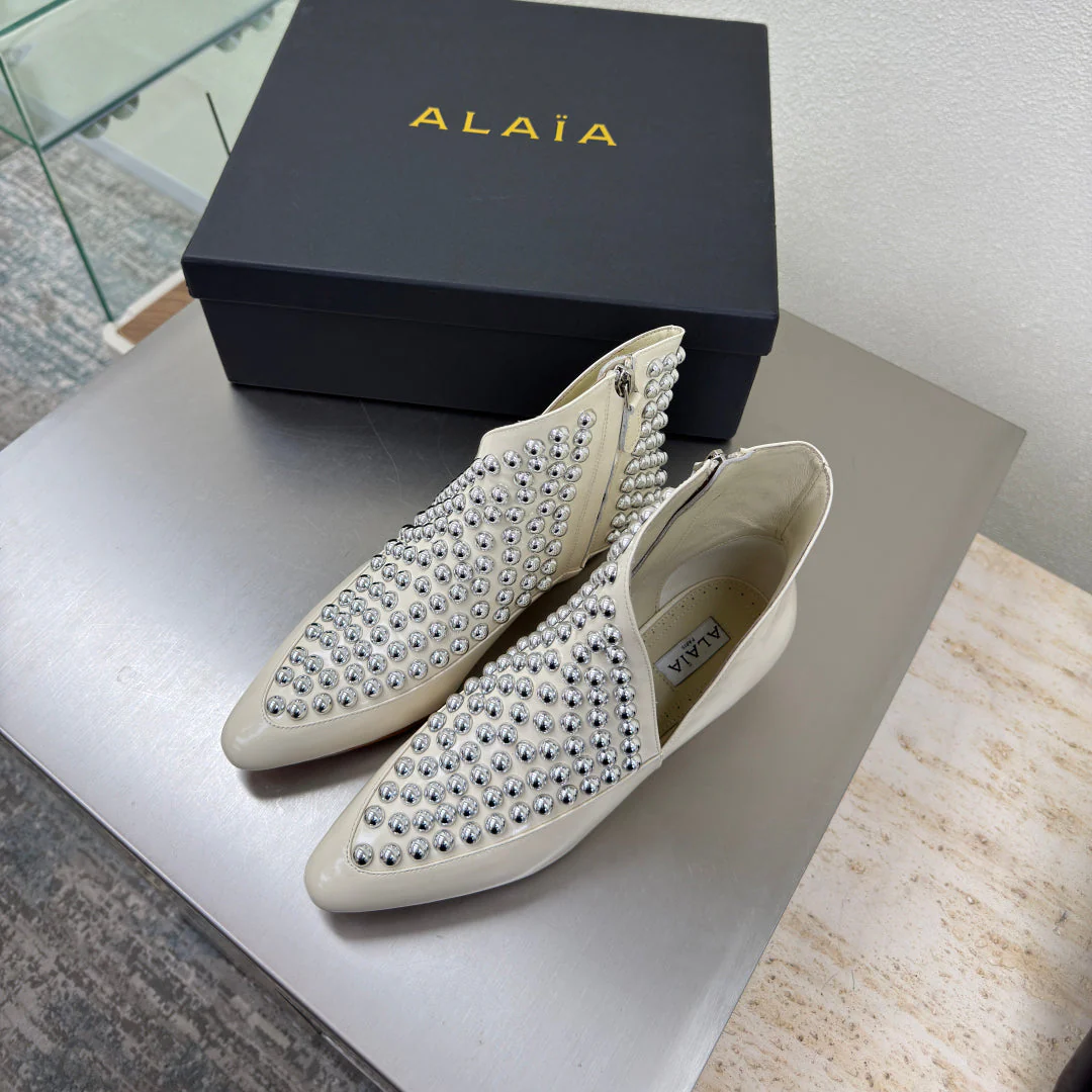 ALAIA Rivet ankle boots ivory cowhide leather 471092