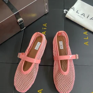 ALAIA BALLET FLATS IN LIGHT PINK MESH FISHNET