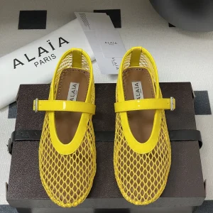 ALAIA BALLET FLATS IN YELLOW MESH FISHNET