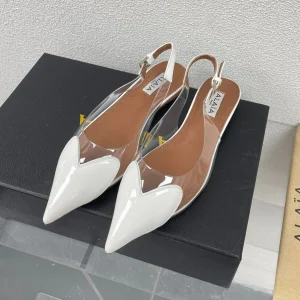 ALAIA LE COEUR FLAT SLINGBACKS IN WHITE PATENT LAMBSKIN