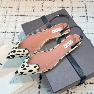 ALAIA FLAT SLINGBACK IN BLACK MIX WHITE PATENT CALFSKIN AND FILM