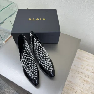 ALAIA Rivet ankle boots black cowhide leather 471093