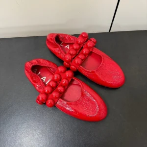 ALAIA SPHERE BALLET FLATS IN CHERRY RED LAMBSKIN